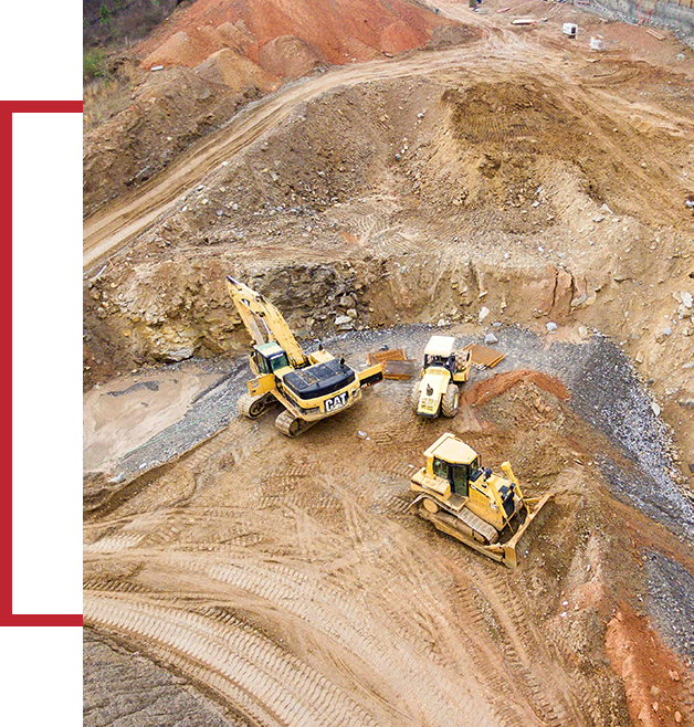 A picture of some construction equipment in the dirt.