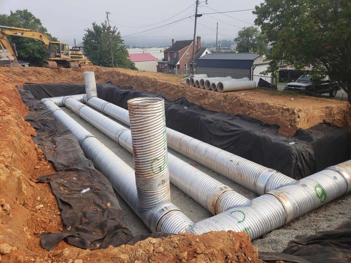 A large pipe laying on top of the ground.